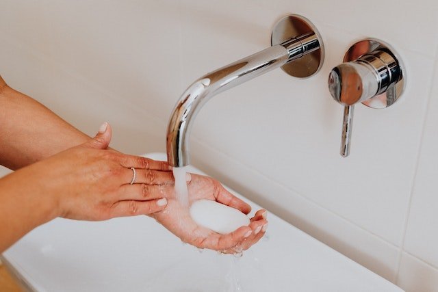 A person holding soap