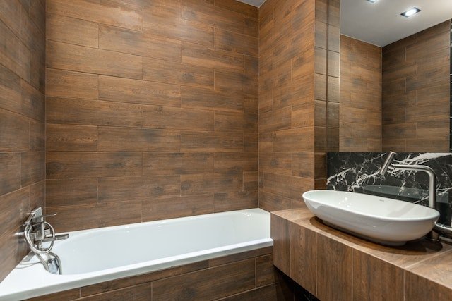 Wood incorporated in a sink and bathtub