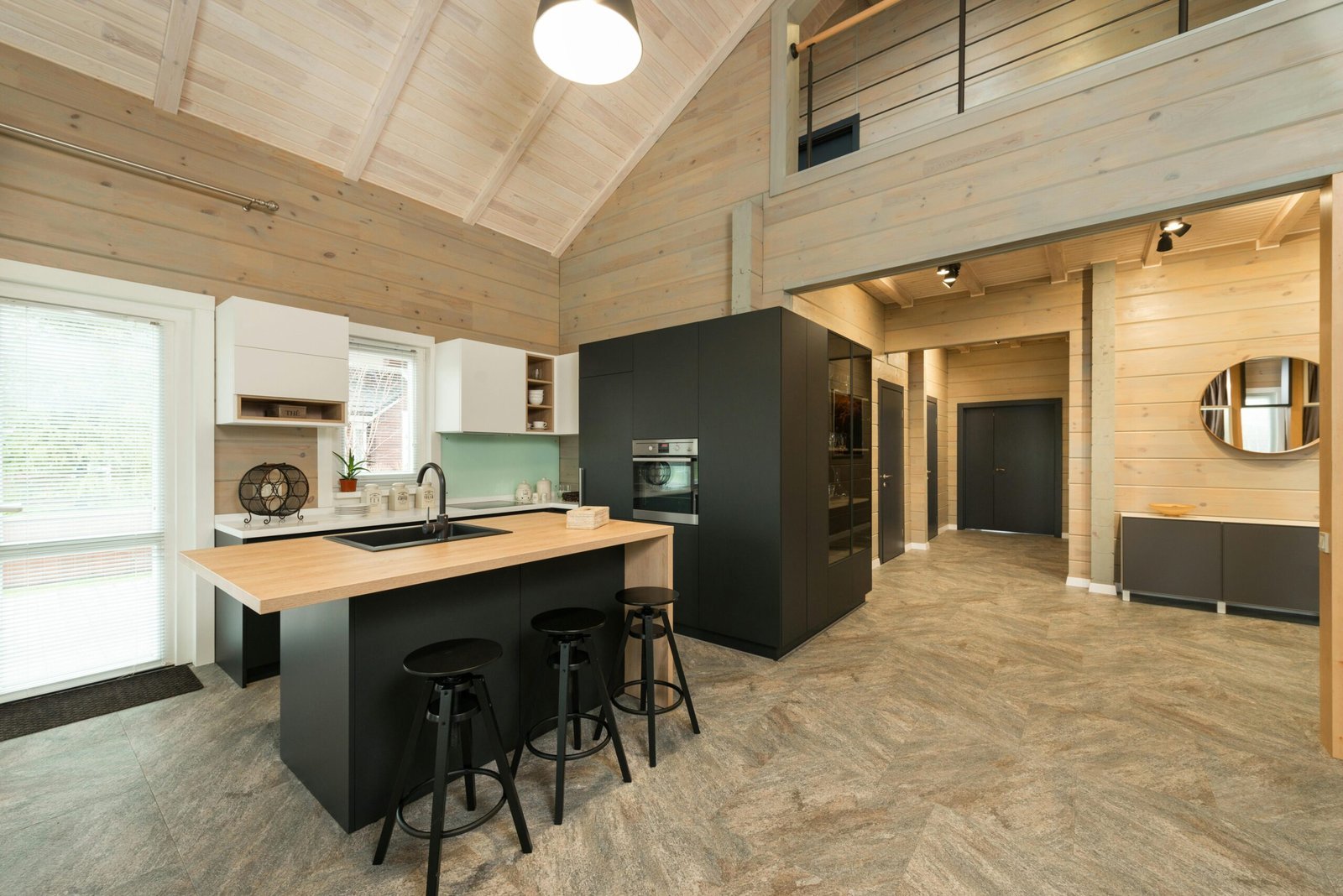 Kitchen with wooden walls, black and wooden furniture