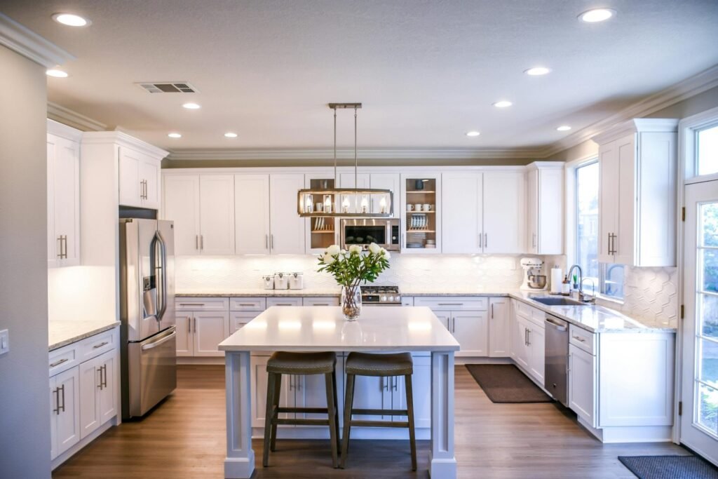 white kitchen with flowers on the table