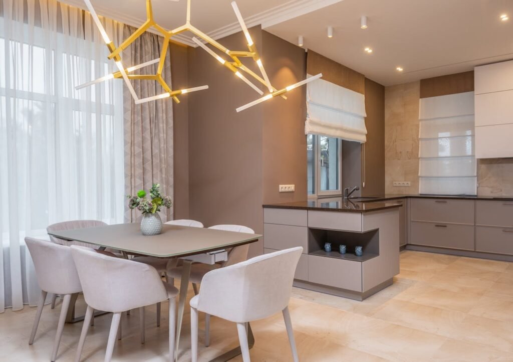 Modern kitchen with table and chairs, with modern light fixture