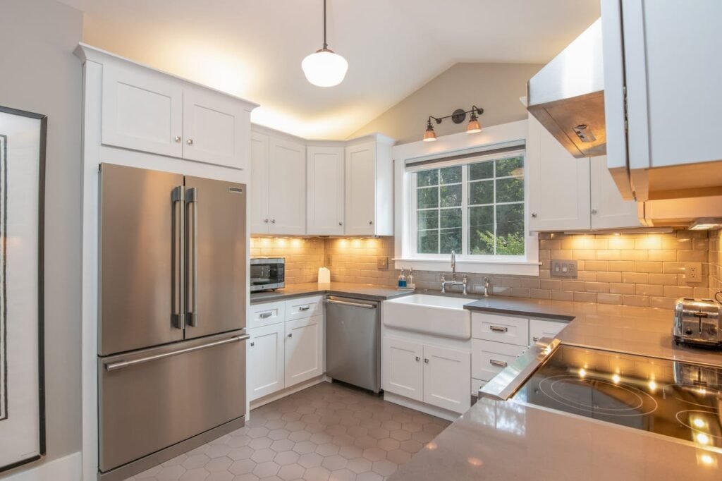 Modern, classical kitchen, lights, white cabinets, metallic fridge